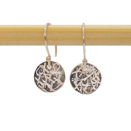 A sweet sentiment with a classy, casual vibe, these sterling silver earrings are each handcrafted and individually stamped. Handmade by Abracadabra exclusive artist MOROKA, a mother/daughter/daughter team committed to creating beautiful jewelry for all.