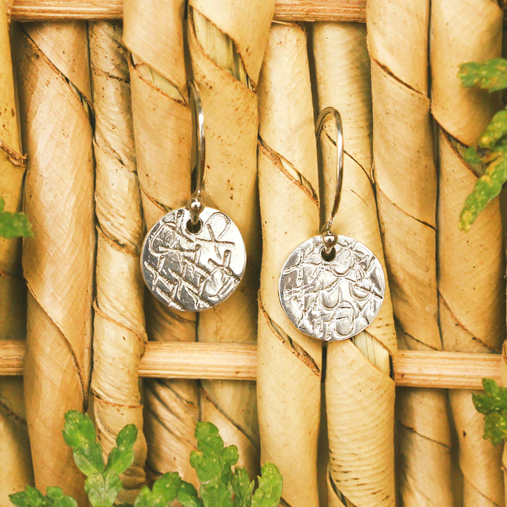 A sweet sentiment with a classy, casual vibe, these sterling silver earrings are each handcrafted and individually stamped. Handmade by Abracadabra exclusive artist MOROKA, a mother/daughter/daughter team committed to creating beautiful jewelry for all.