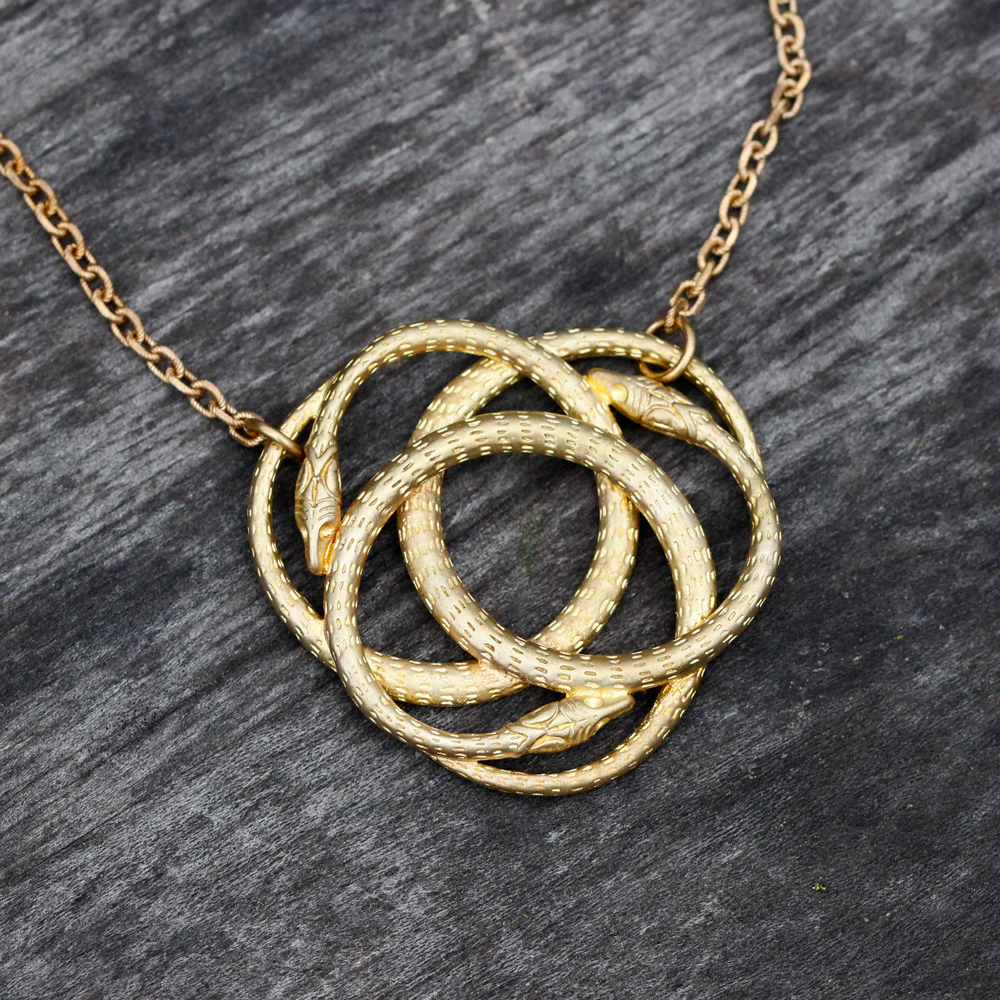 We Dream In Colour Brass Snake Knot Necklace